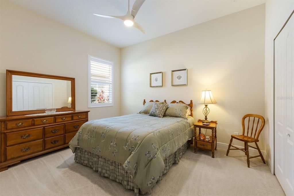 Guest bedrooms at the front of the home offering a split floorplan