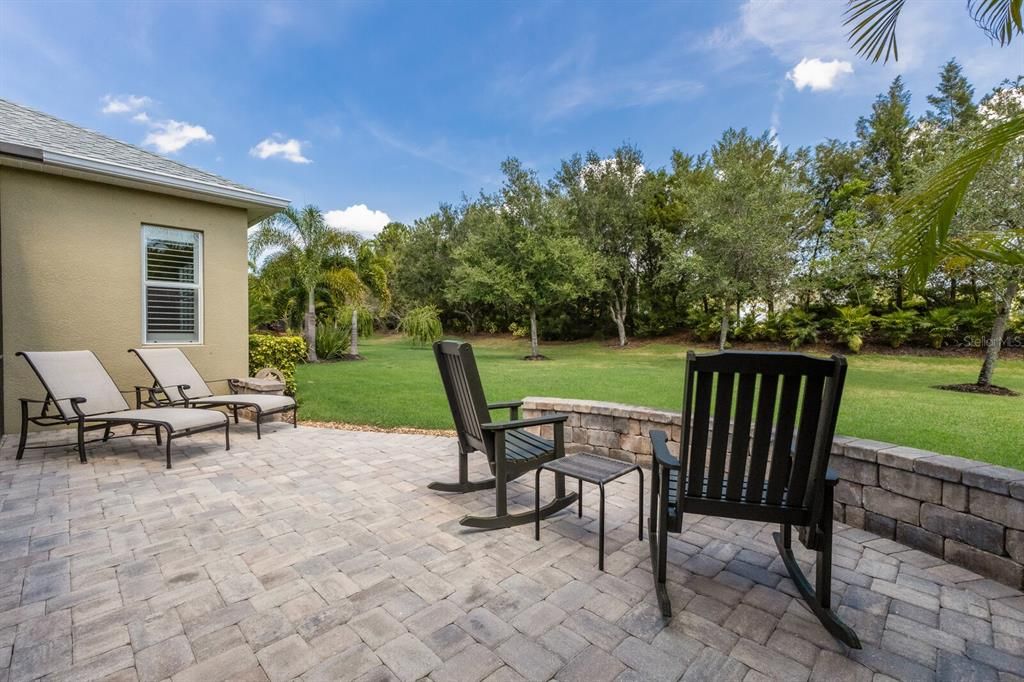 Extended paver patio outside of the screened ensclosure - perfect for entertaining for a fire pit!