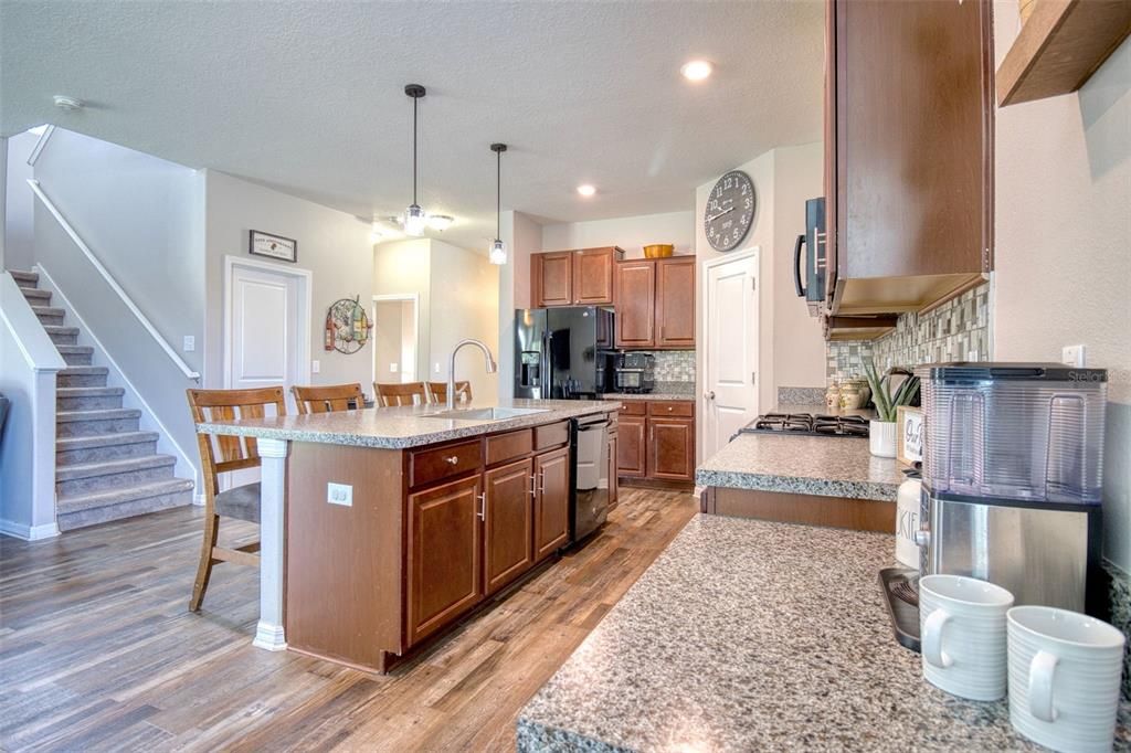 Abundant Storage ensures a clutter-free and organized space. The custom cabinetry, spacious walk in pantry, and well-placed drawers offer ample room to keep all your kitchen essentials within easy reach.