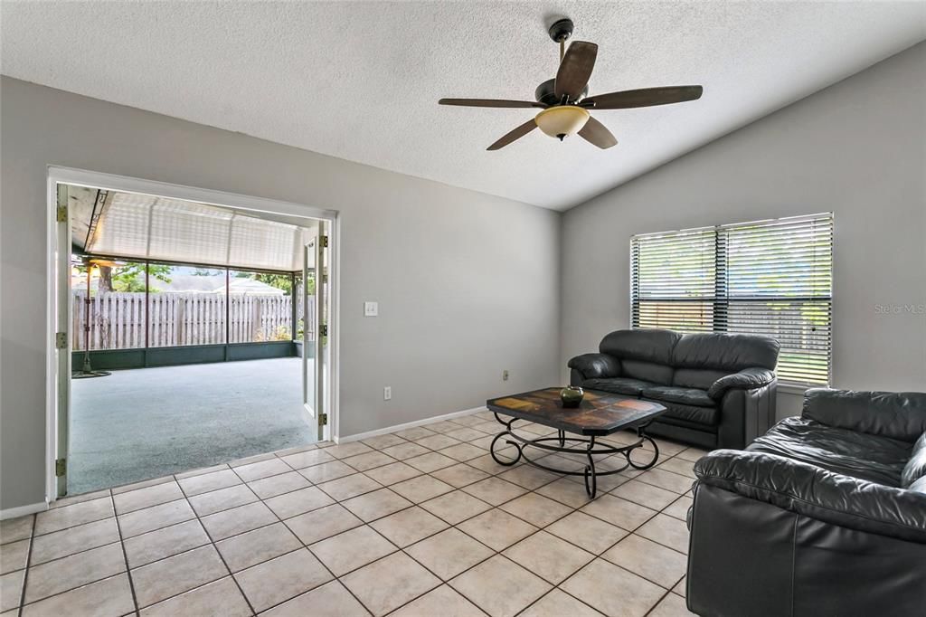 Living room with french doors leading out to the lanai