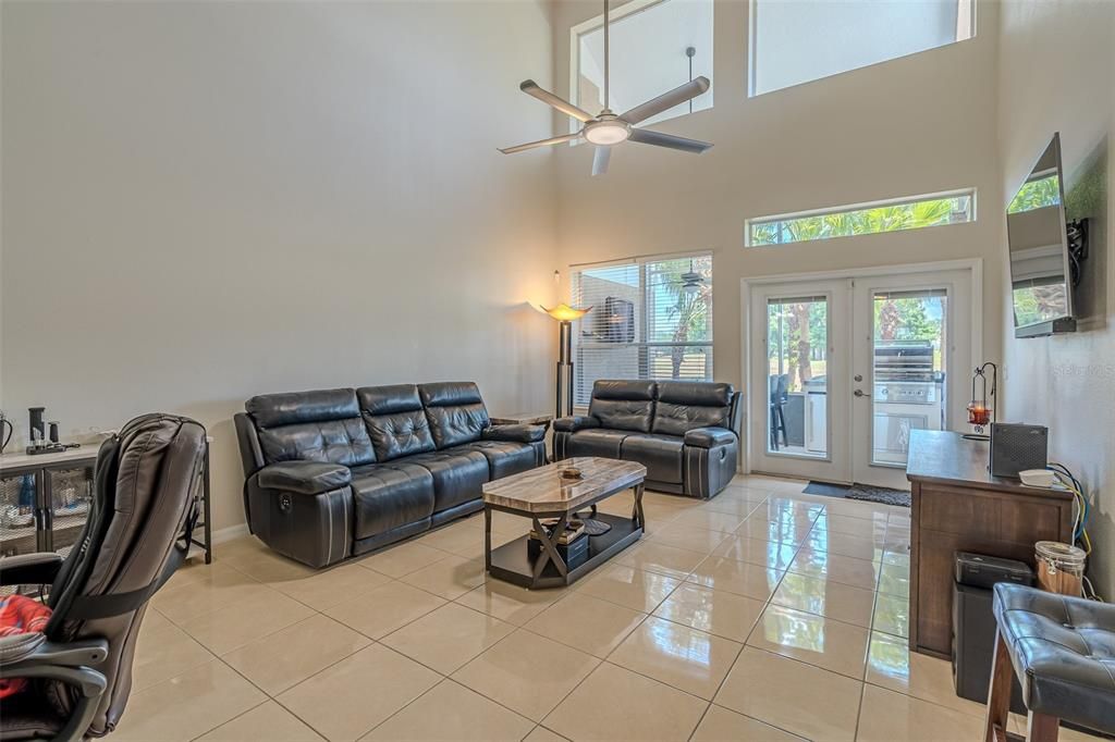 Living Room with French Doors and Transom windows giving lots of natural light.