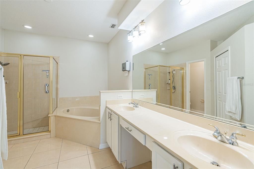 Main Floor - Primary Bathroom - Jetted Tub with separate shower and private water closet.