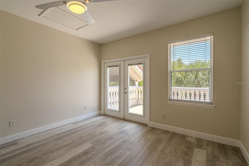 2nd Floor - Bedroom 2 with French Doors that lead to the balcony overlooking the golf course.