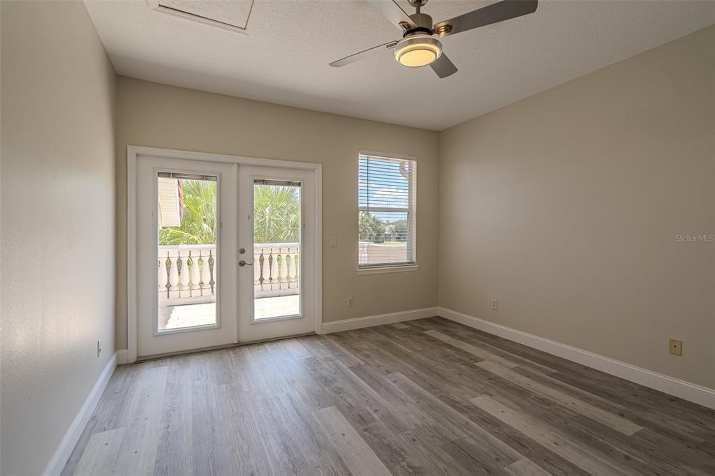 Upstairs bedroom with the balcony overlooking the golf course.