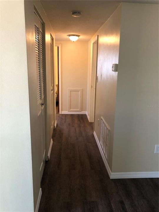 Hallway with linen closets