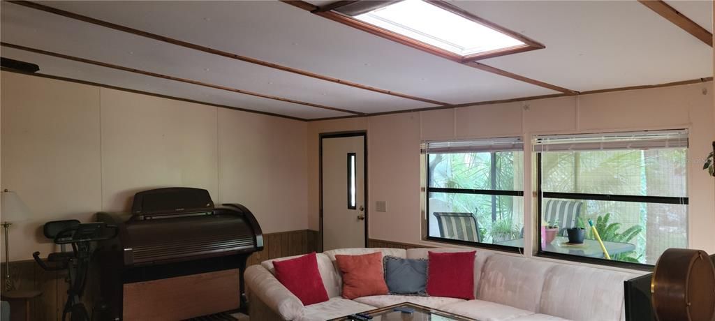 living room with skylight