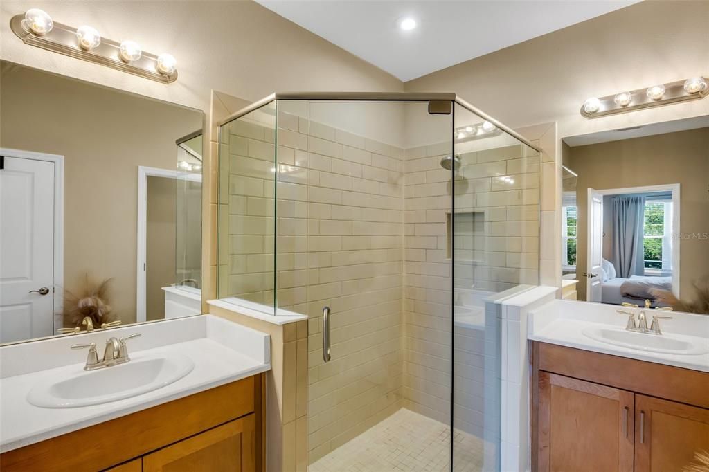 Large primary ensuite with 2 sinks, shower, water closet, linen closet and separate walk in closet