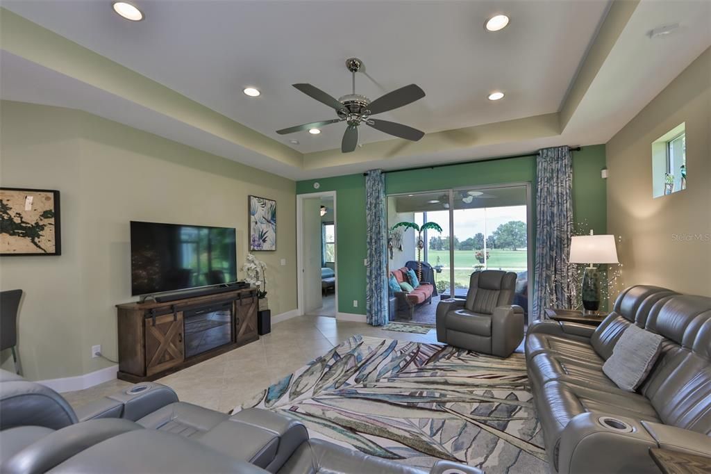 Open floor plan allows for easy entertaining with access to the screened, extended patio for a greenbelt vista.