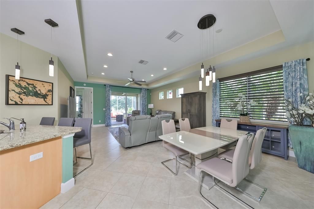 An open floor plan, contemporary lighting, and freshly painted interior create a welcoming and comfortable home.