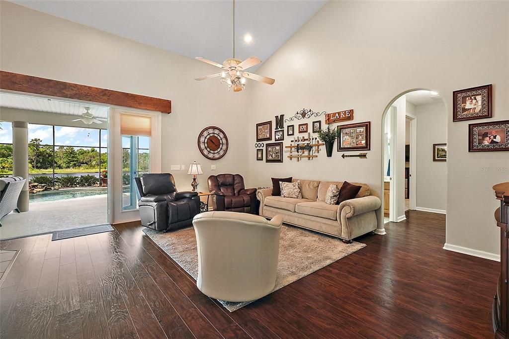 The amazing family room with vaulted ceiling and French doors to those views!