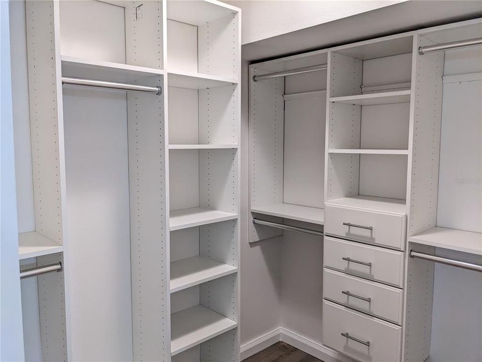 Walk-in closet in primary bathroom