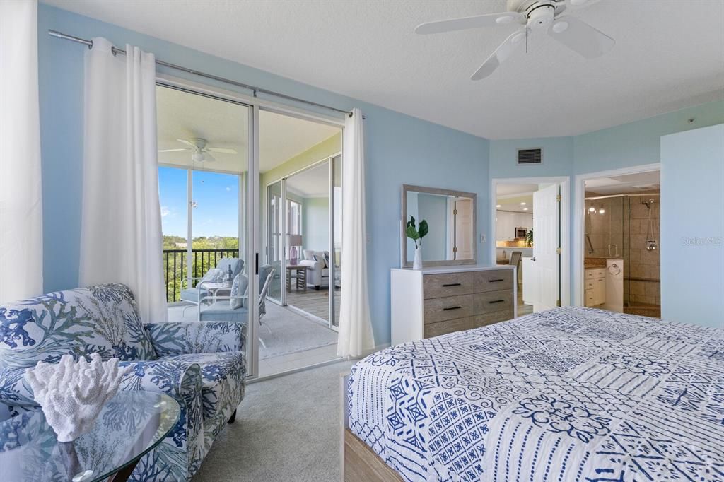 Primary bedroom with patio access