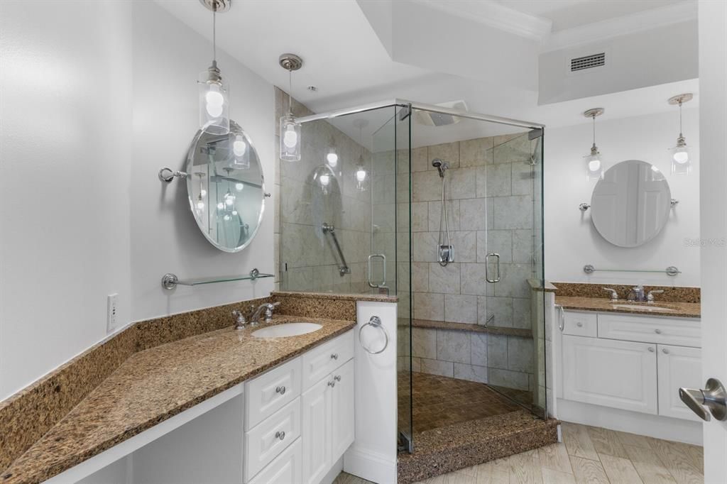 Primary bathroom with 2 sinks and private water closet