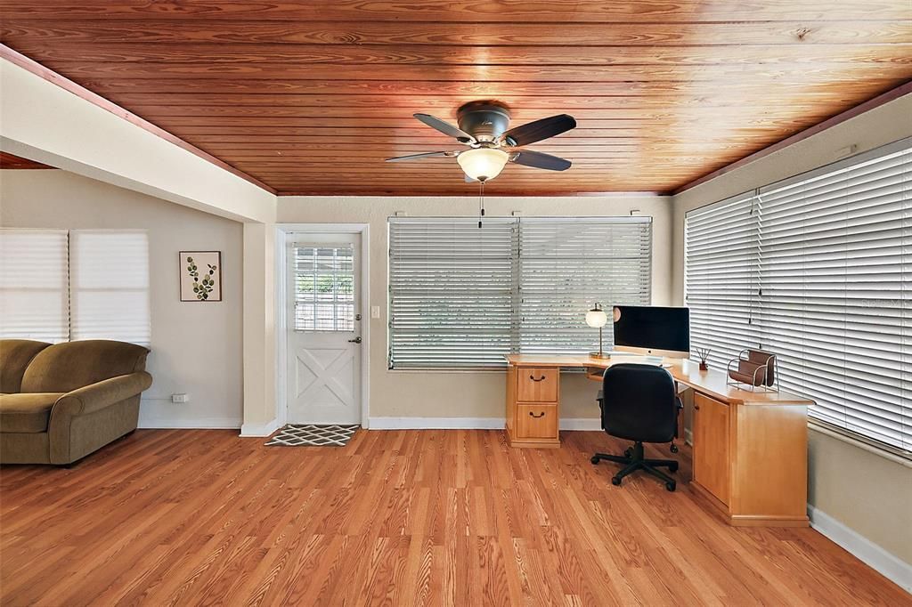 Office/den with door to carport; note the large, light-filled windows