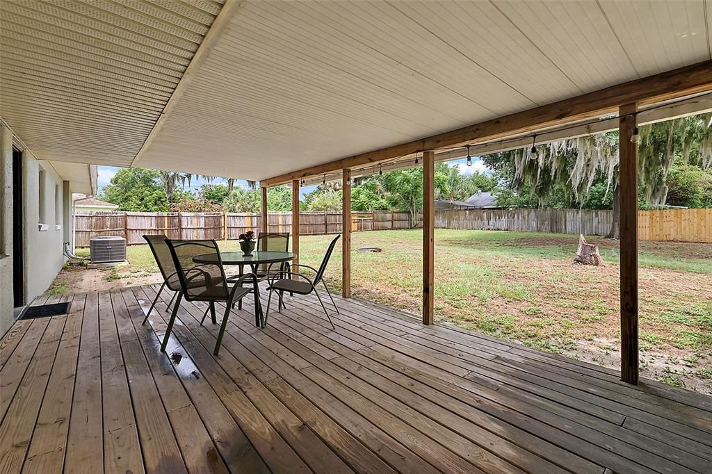 Kitchen and carport access to the large back yard with decking