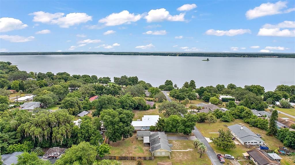 This home is steps from Little Lake Harris and the Howey boat ramp