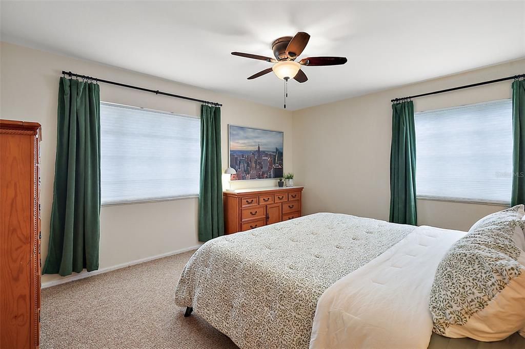 Bedroom 2 has ceiling fan and walk in closet