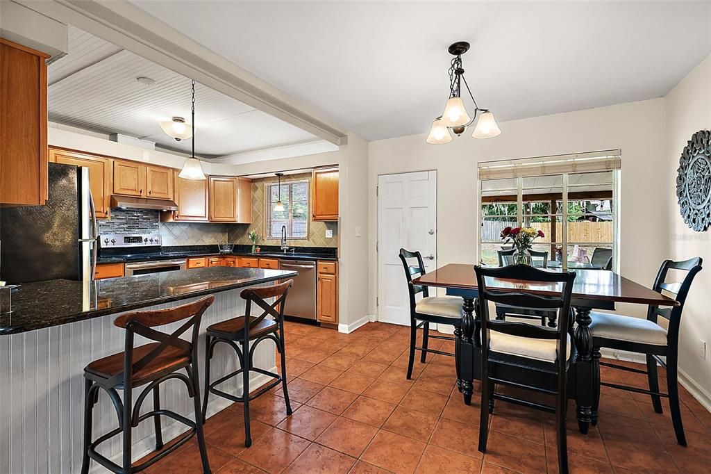 Dining/kitchen area; door to backyard/deck