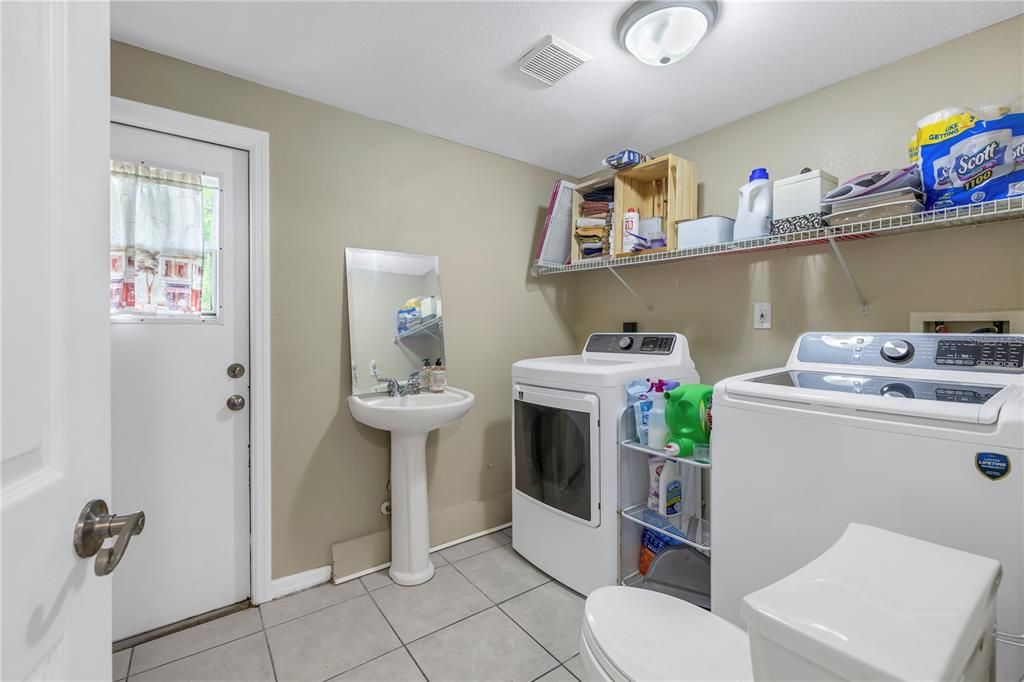 Laundry and 1/2 bath off Family Room with exterior exit to backyard.