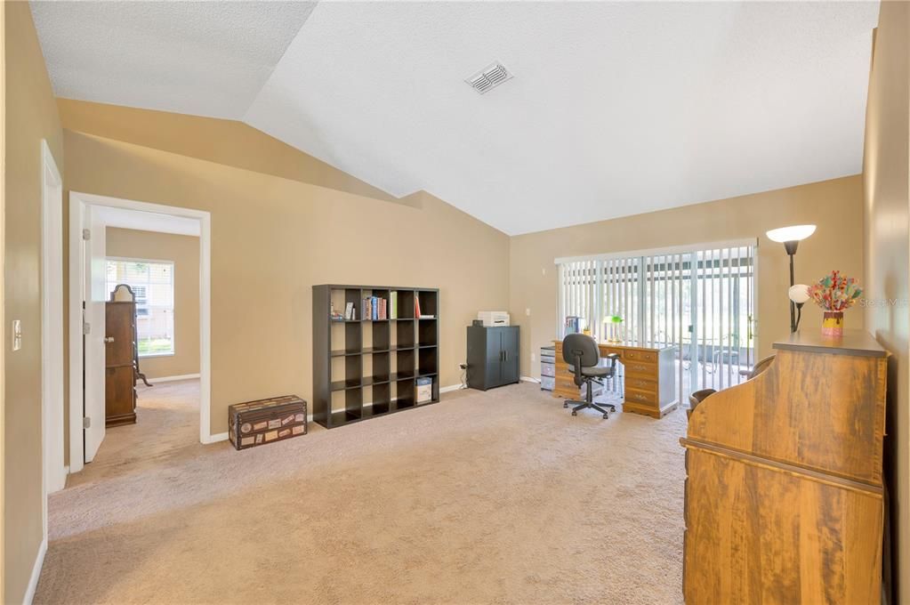 Formal living room with sliders to the large screened lanai