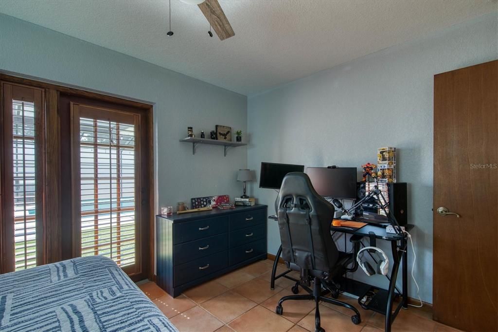 French doors in family room leading to pool area