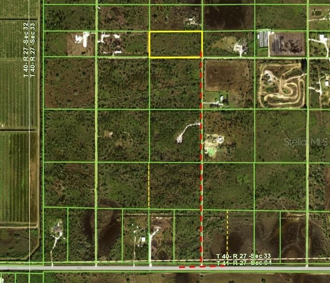 Aerial showing property on NW corner of an intersection 1/2 mile north of SR74 and across from Bass property with home on SE corner.