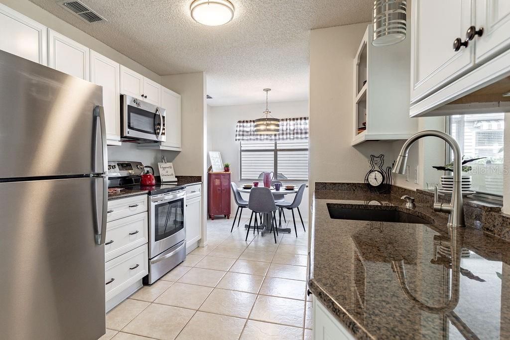 Kitchen with Stainless Appliances and a cute Nook.