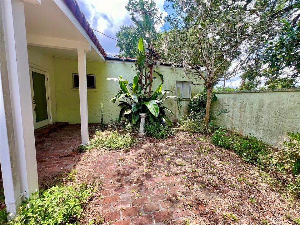 courtyard w/ small covered patio