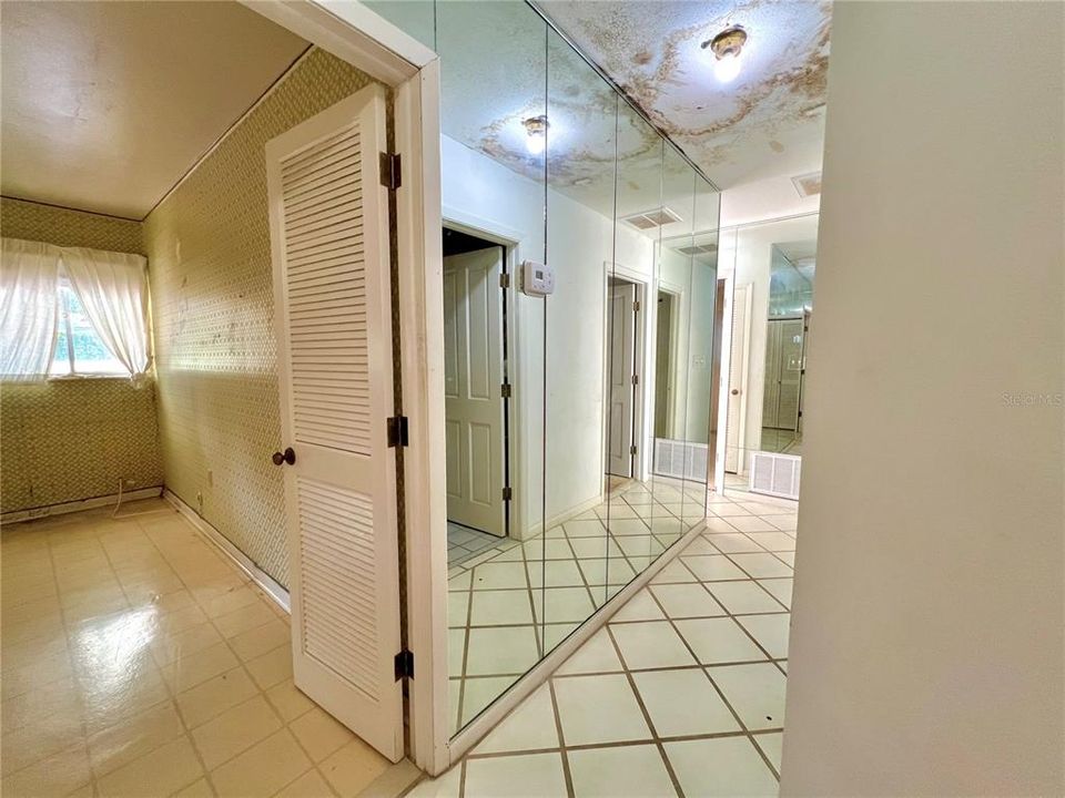 hallway leading to bedrooms & bathrooms