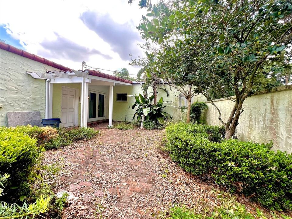 courtyard w/ small covered patio