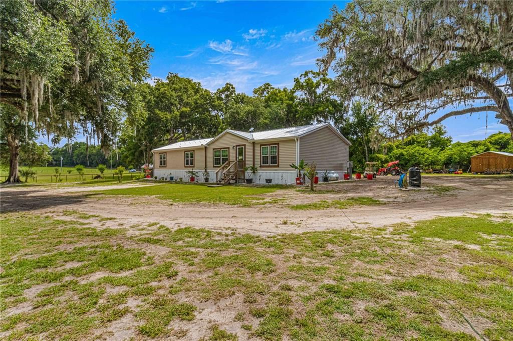 18X32 SHED TO BACK RIGHT OF HOME