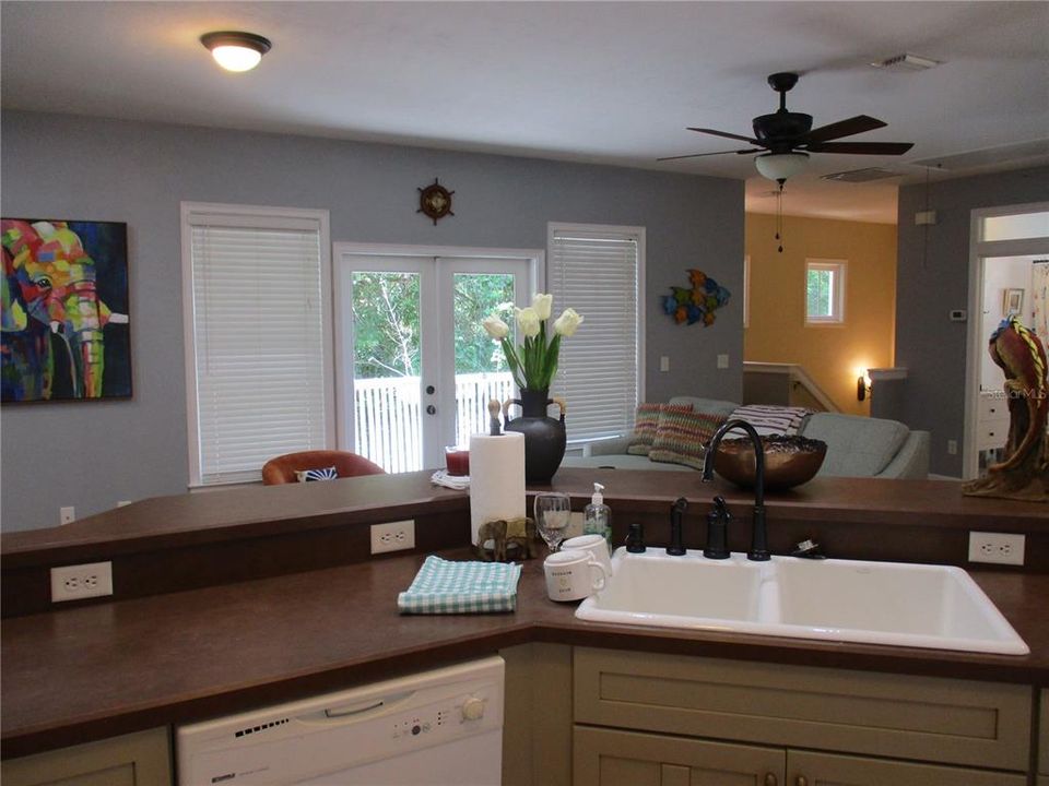 Kitchen view into great room with french doors