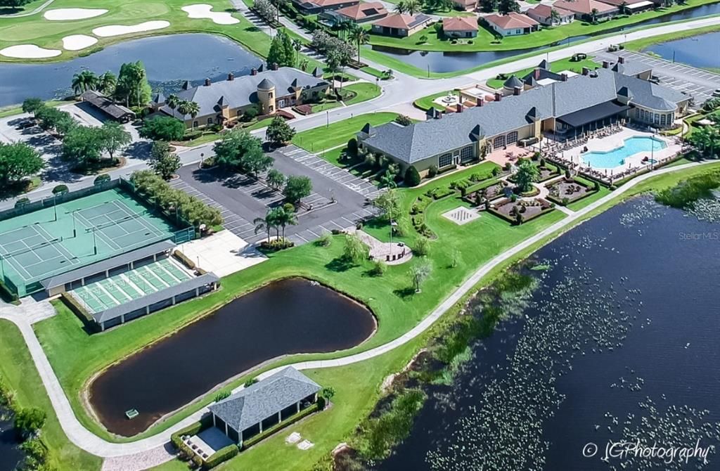 The main clubhouse grounds have lighted tennis and shuffleboard courts, community gazebo, basketball court, horseshoe pits, veterans memorial, English garden with oversized chess board, pool and spa, and lawn bowling/bocce courts.