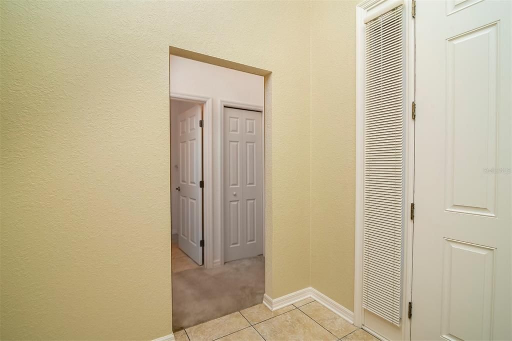 The passageway in the foyer leads to the 2 guest bedrooms and the guest bathroom.