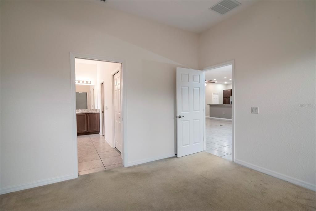 There is a pocket door that can isolate the master bath from the bedroom.