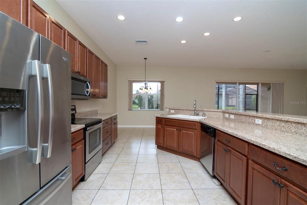 The kitchen flows into the breakfast nook and the combination living and dining room.