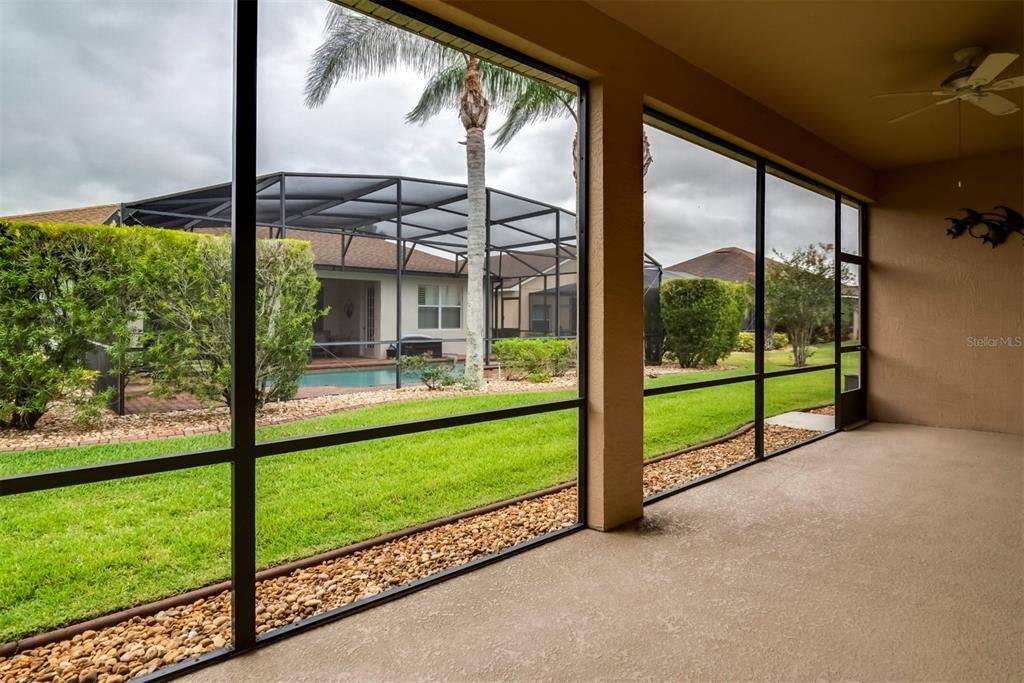 The decorative concrete edging and stone mulch protects the screen from "weed eater attacks".