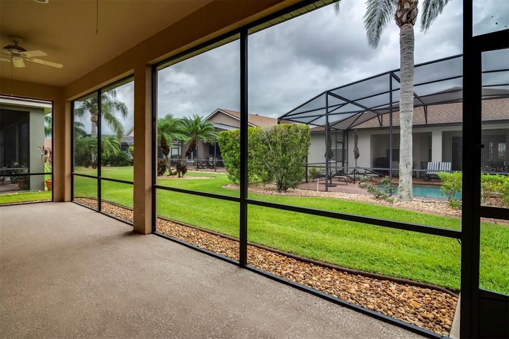 The huge covered and screened lanai is on the east side of the home and is shaded in the afternoon.