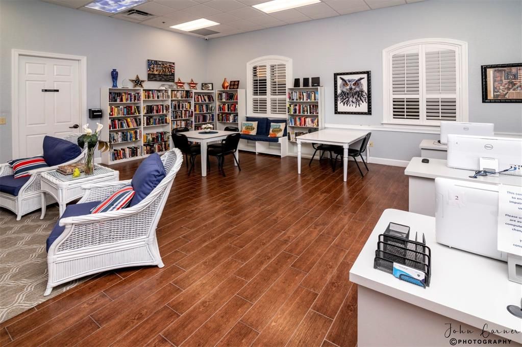 The Health and Fitness Center media room is home to an honor system lending library and computer equipment for residents.