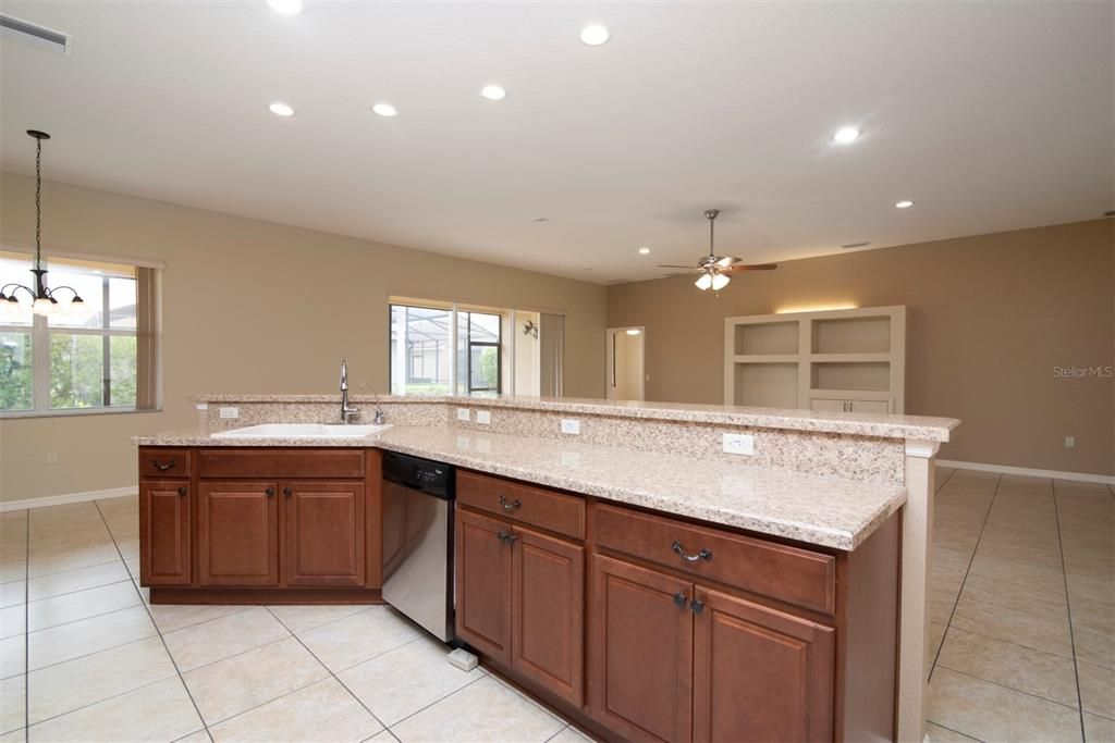 The wraparound snack bar holds the sink and dishwasher.