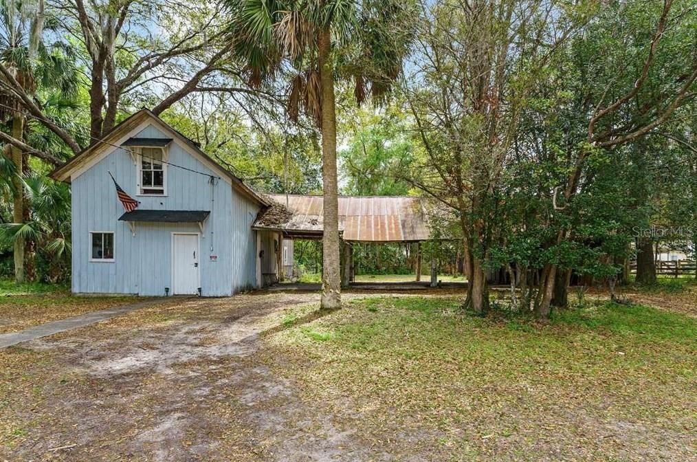 Exterior Storage Building w/carport spaces