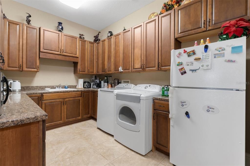 12'x10' Laundry Room with a sink and plenty of Counter tops and Cabinets