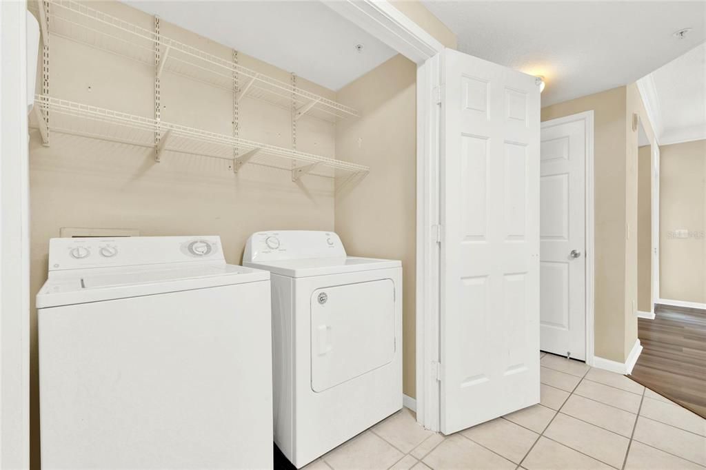Laundry Closet featuring washer and dryer
