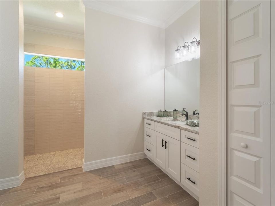 Master bathroom with split vanities