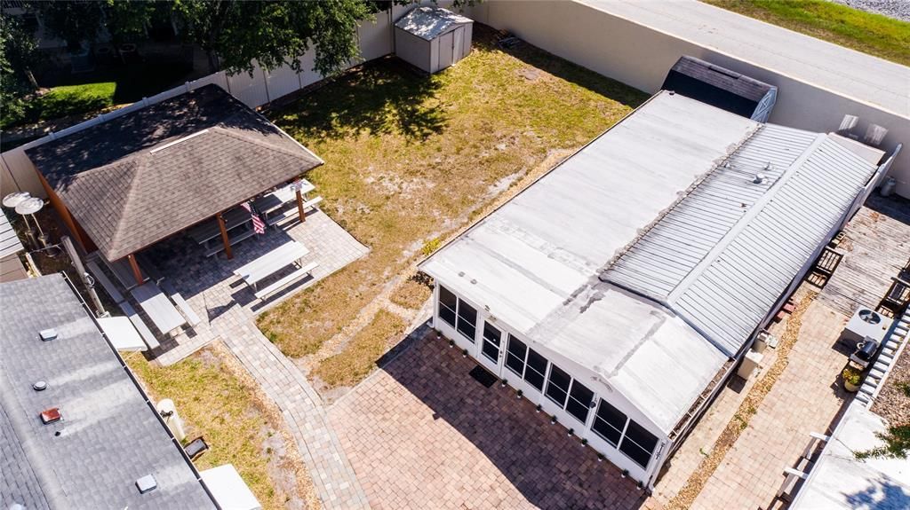 Aerial view of the home showing the metal roof and location of the home next to the Community area.