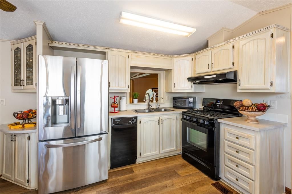 Kitchen includes all appliances including countertop microwave.  Cabinets are brushed.