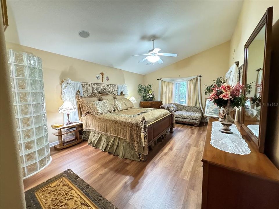 Bedroom #2 with view of conservation, new luxury vinyl floor