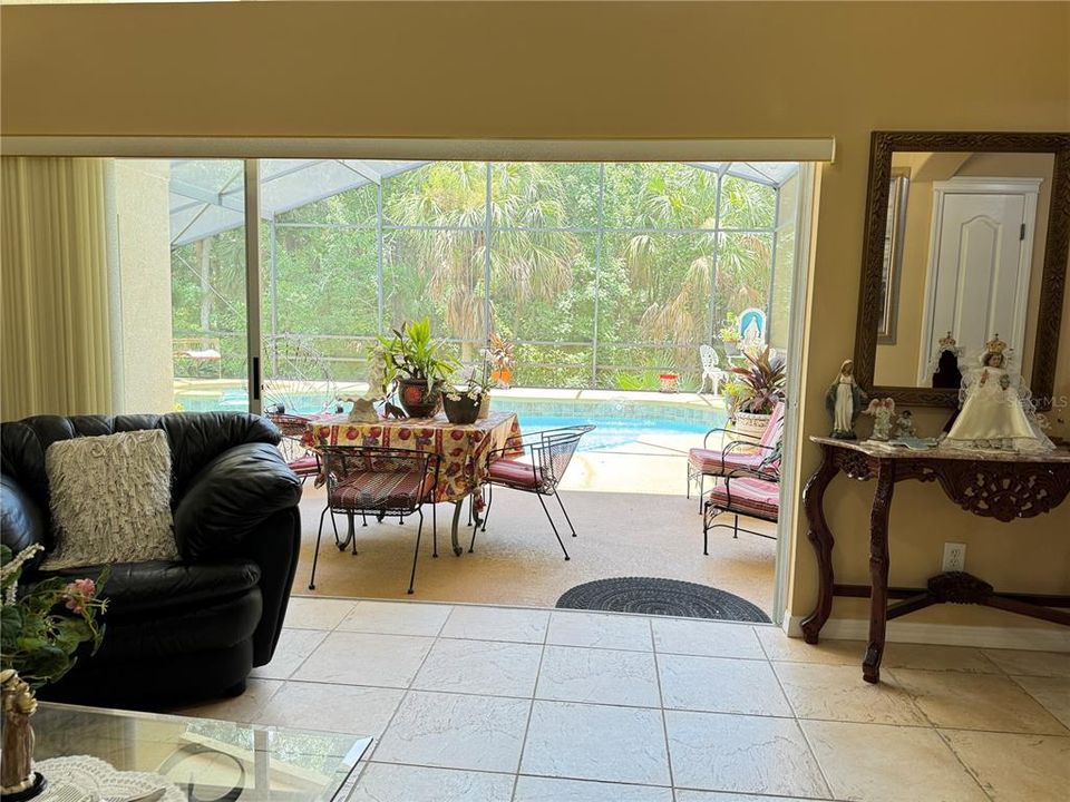 View of stairs leading to bonus room/bedroom, wooden handrail and spindles in upper lever, gas burning fireplace, art niches