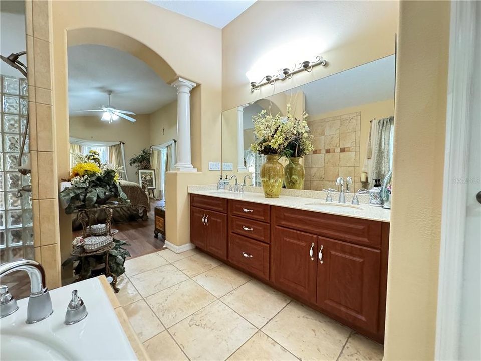 Master bathroom - beautiful custom tile work and glass block in shower, newer Kohler showerhead