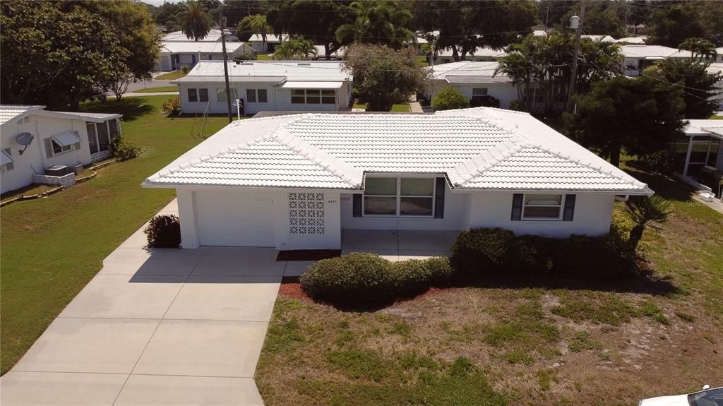 Aerial view of the home in the beautiful 55+ Tamarac by the Gulf community